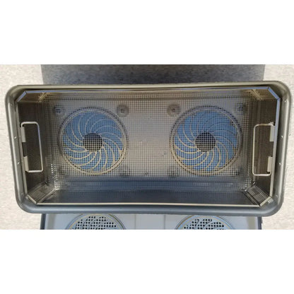 Rectangular stainless steel mesh basket with two circular blue fan blades inside aesculap jk489 jk442 sterilization container