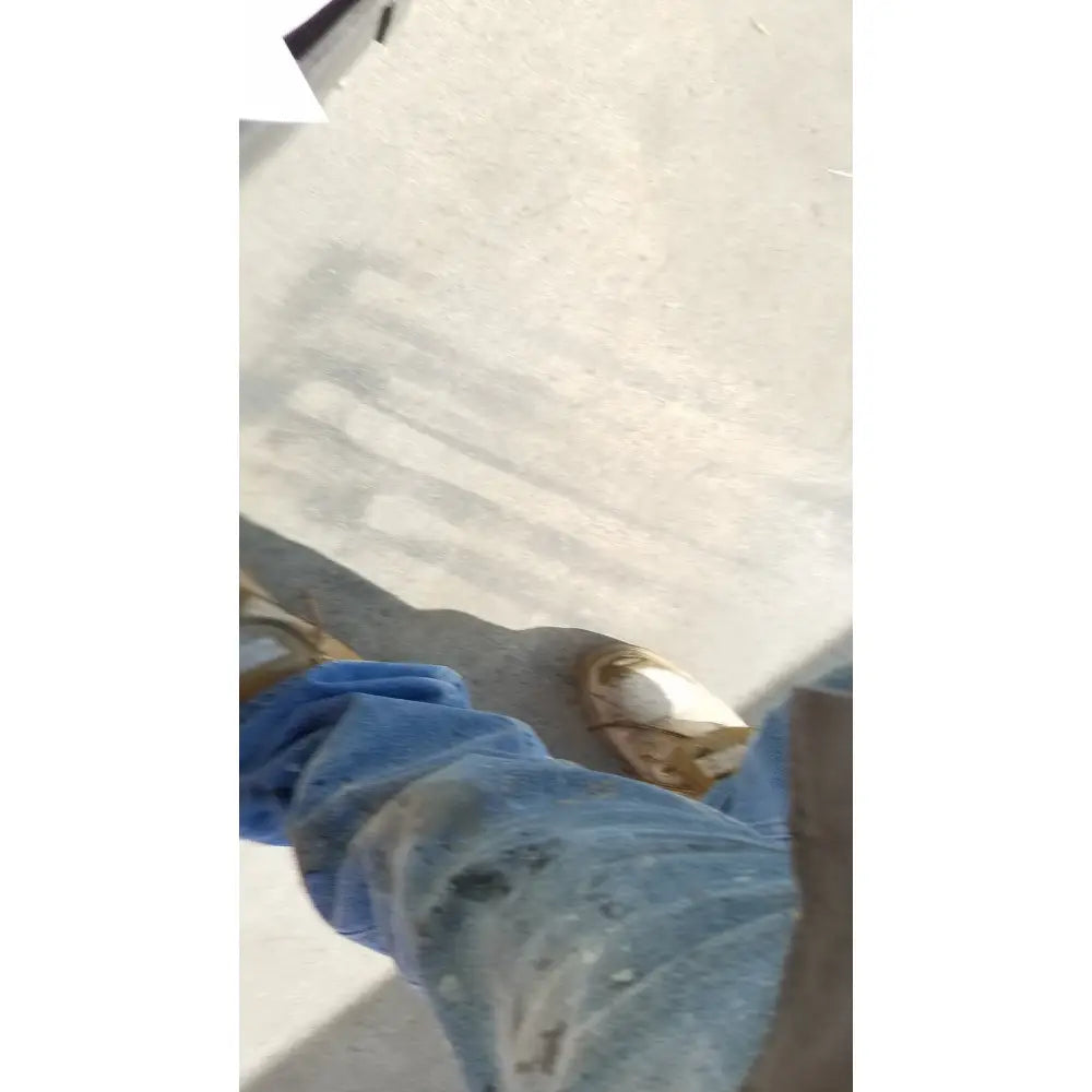 Worn blue denim jeans with stains and creases shown alongside aesculap jk489 jk442 sterilization container case