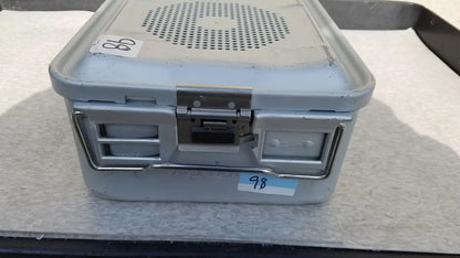 Gray metal aesculap jk489 jk442 sterilization container case with perforated lid and sturdy latches for medical use