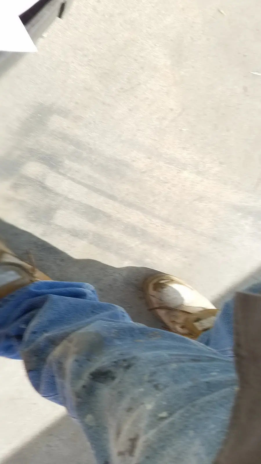 Worn blue denim jeans with stains and creases shown alongside aesculap jk489 jk442 sterilization container case