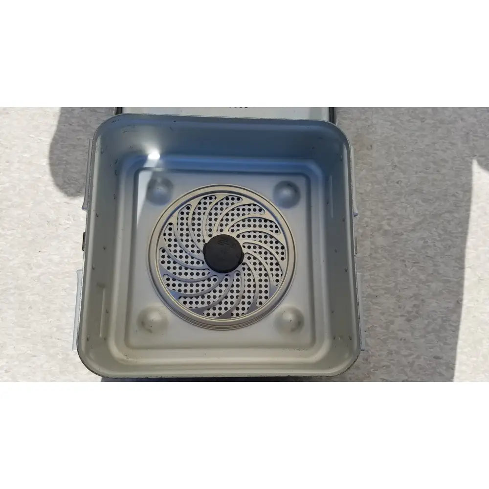 Gray plastic air fryer basket with circular perforated insert and black center component for aesculap jn340 instrument sterilization container tray