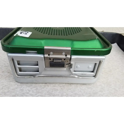 Green and silver aesculap jn341 sterilization container with perforated metal lid latch and side compartments