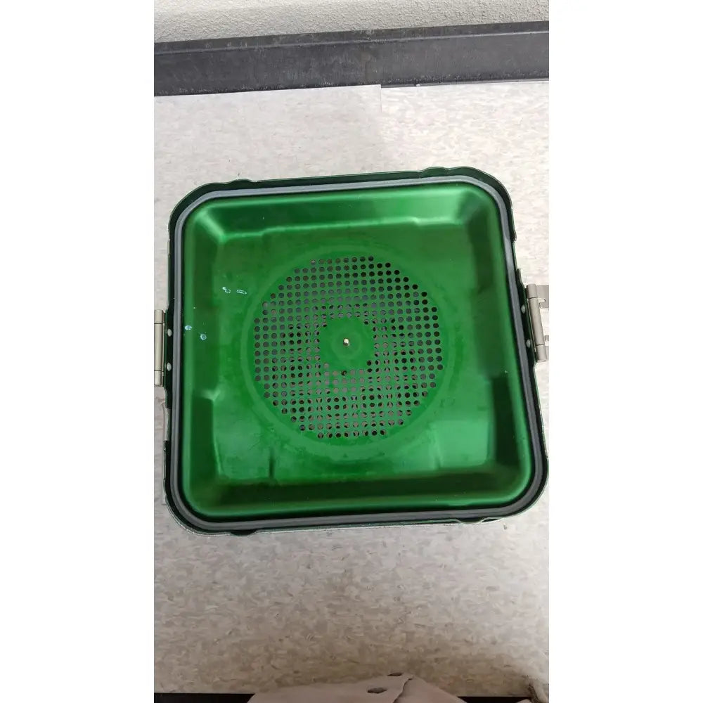 Green plastic aesculap jn341 sterilization container with perforated center and black reinforced edges for secure use