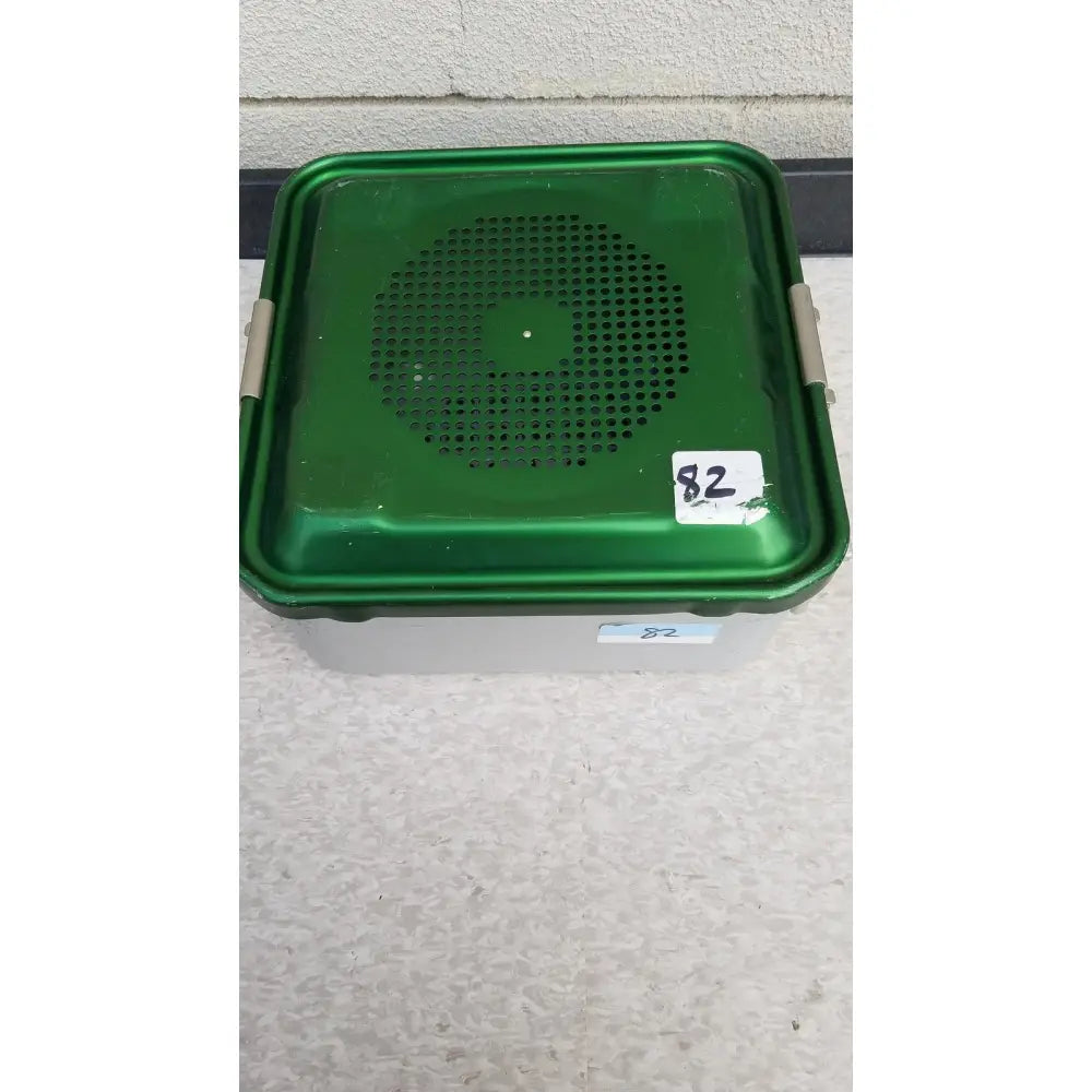 Green plastic aesculap jn341 sterilization container with perforated lid and silver latches for secure sterilization