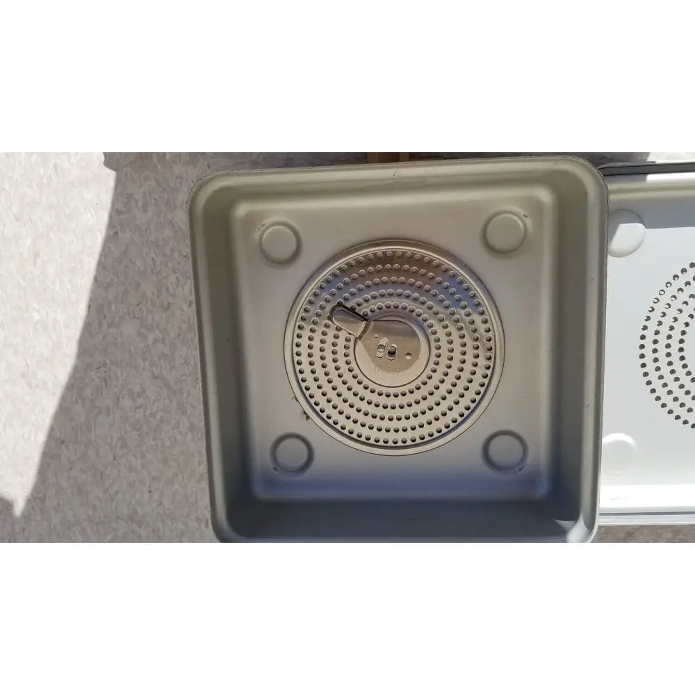 Silver metallic gas burner with circular perforated design and central ignition in aesculap jn342 sterilization container system