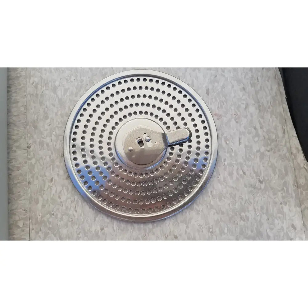 Circular stainless steel strainer with perforated design and central handle for aesculap jn342 sterilization container system