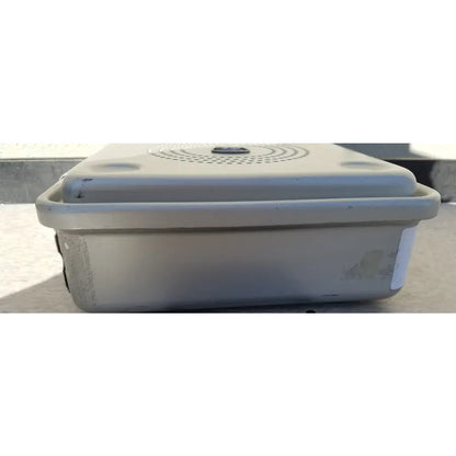 Beige plastic aesculap jn342 sterilization container with lid featuring circular ventilation holes and rounded edges