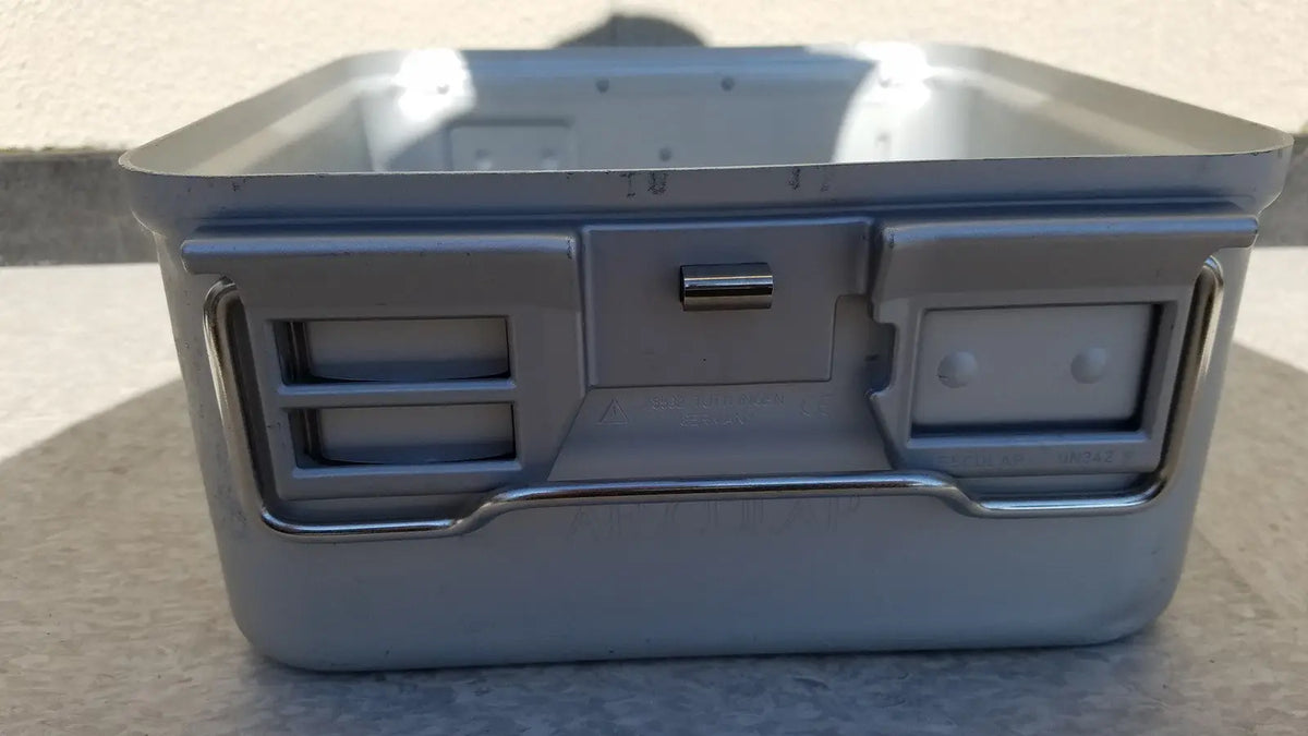 Gray metal aesculap jn342 sterilization container with handle and two latches without lid for medical use