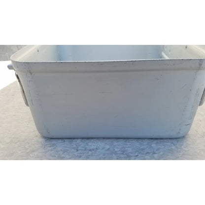 White rectangular plastic storage bin with rounded corners and side handles in aesculap jn342 sterilization container system without lid