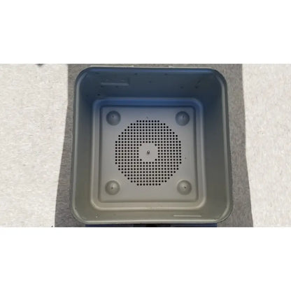 Gray plastic aesculap jn342 sterilization container with circular perforated grille and four rounded feet without lid