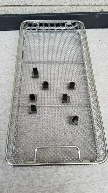 Aesculap JN821 sterilization case stainless steel mesh tray with black plastic clips for instrument storage