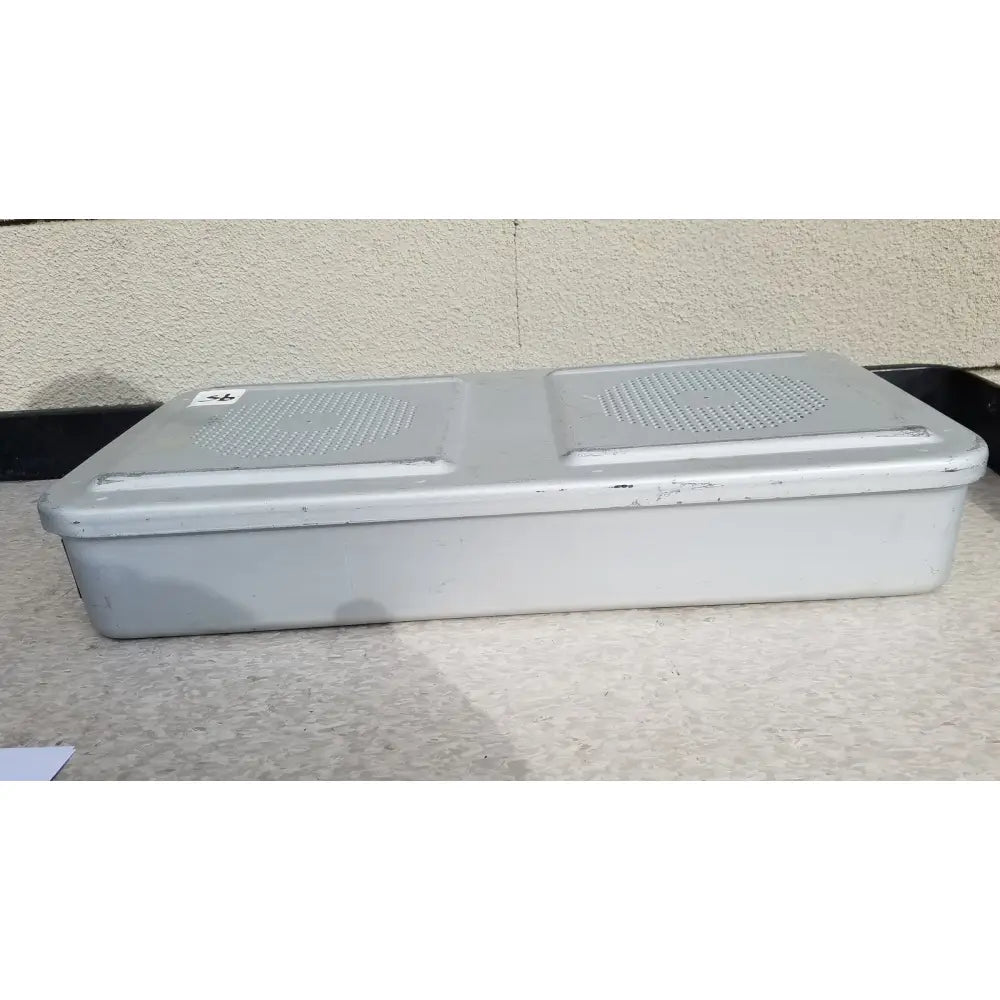 Gray plastic rectangular aesculap jn821 sterilization case instrument tray with two perforated grilles on top surface