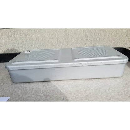 Gray plastic rectangular aesculap jn821 sterilization case instrument tray with two perforated grilles on top surface