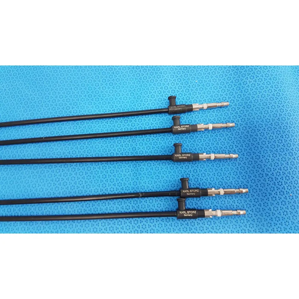Four black aesculap laparoscopic graspers with silver metallic tips branded karl storz germany for reuse medical use