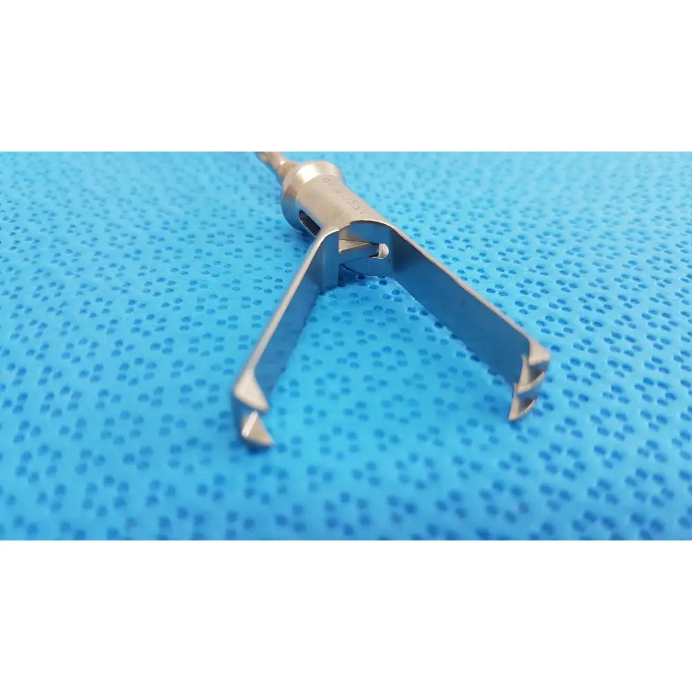 Stainless steel aesculap laparoscopic grasper model p0623r with textured metallic finish and two angled prongs