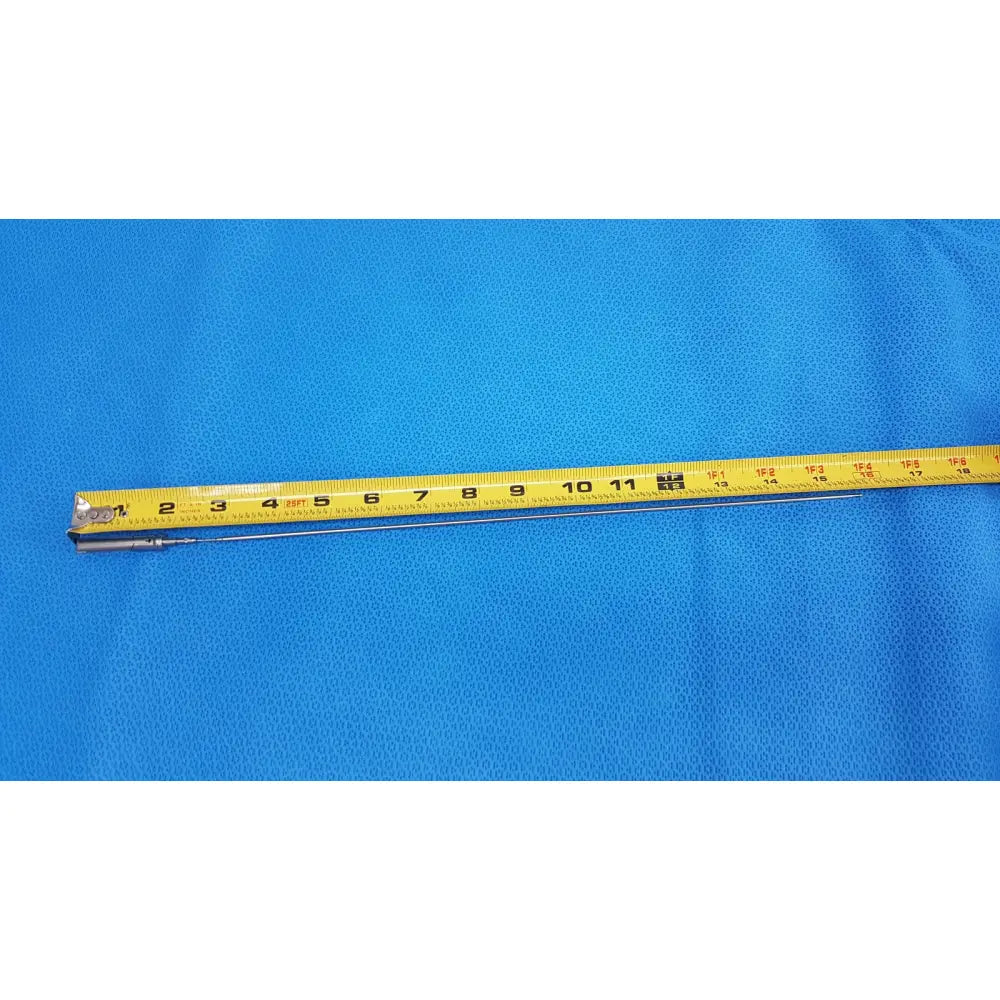A yellow measuring tape with black markings and metal end on blue surface for aesculap laparoscopic grasper model p0623r