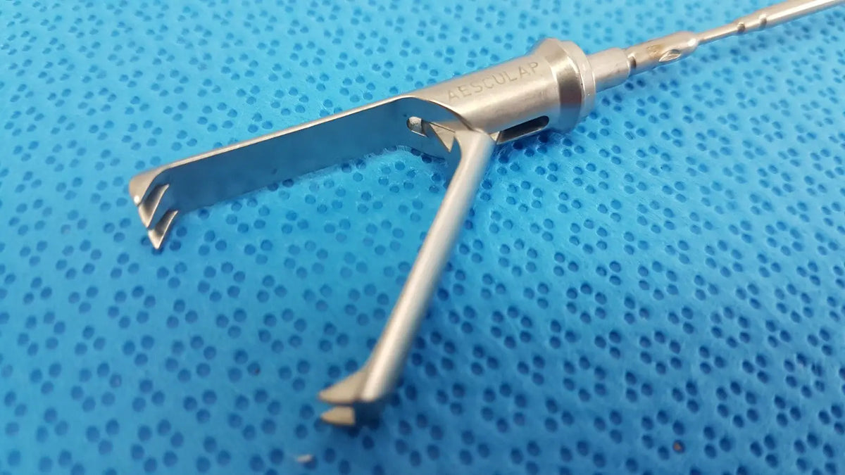 Aesculap laparoscopic grasper model p0623r metallic instrument with silver textured handle and opposing prongs for tissue gripping