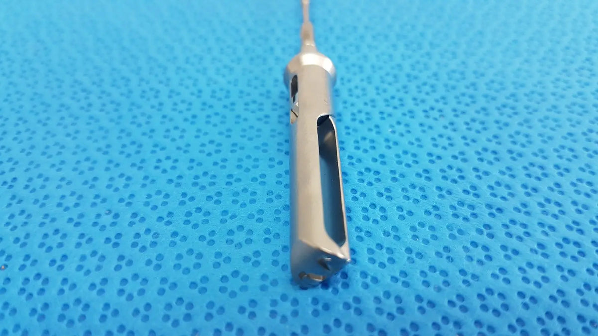 Silver aesculap laparoscopic grasper model p0623r with slender metallic shaft and precision-cut handle