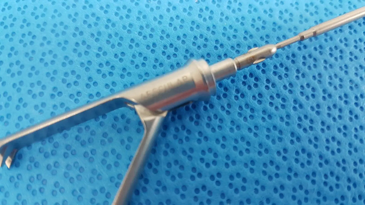 Stainless steel aesculap laparoscopic grasper model p0623r with slender polished shaft and articulated fine-tipped blades