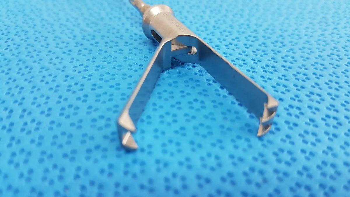 Stainless steel aesculap laparoscopic grasper model p0623r with textured metallic finish and two angled prongs