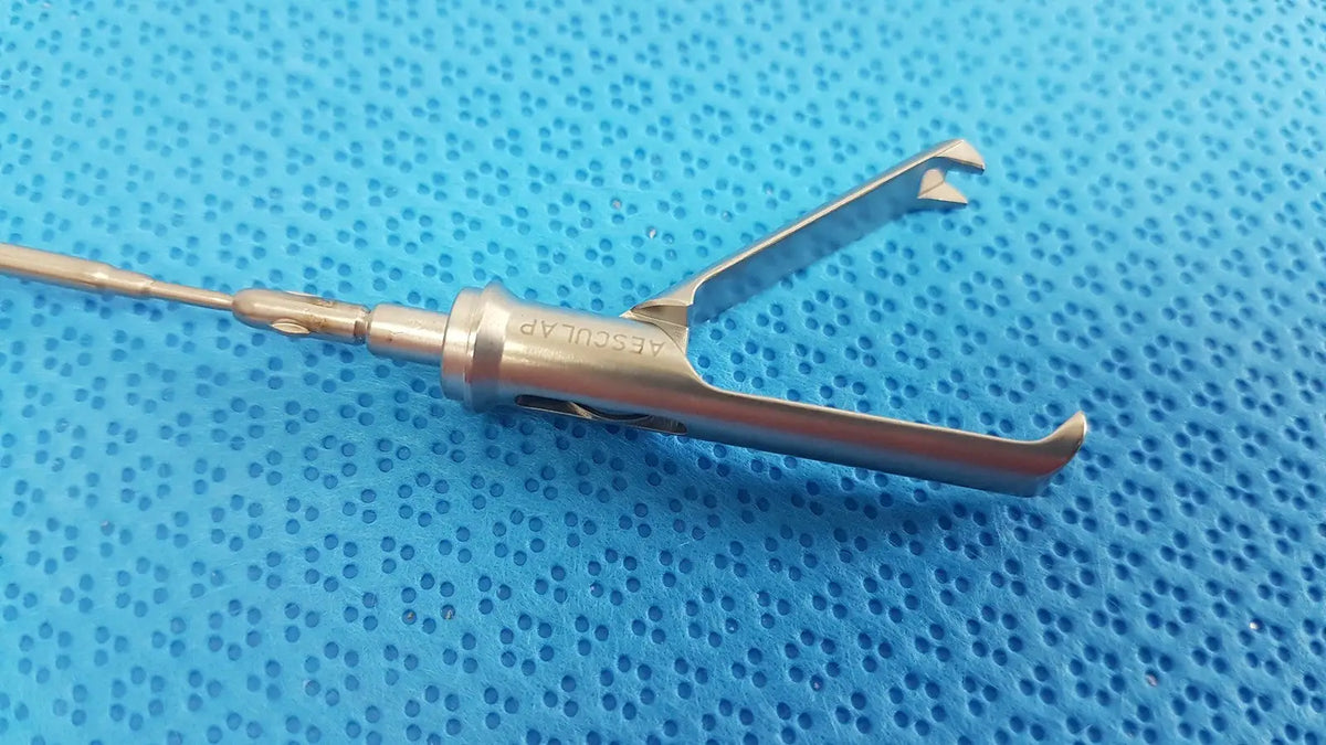 Stainless steel aesculap laparoscopic grasper model p0623r with polished dual-pronged design and branded handle