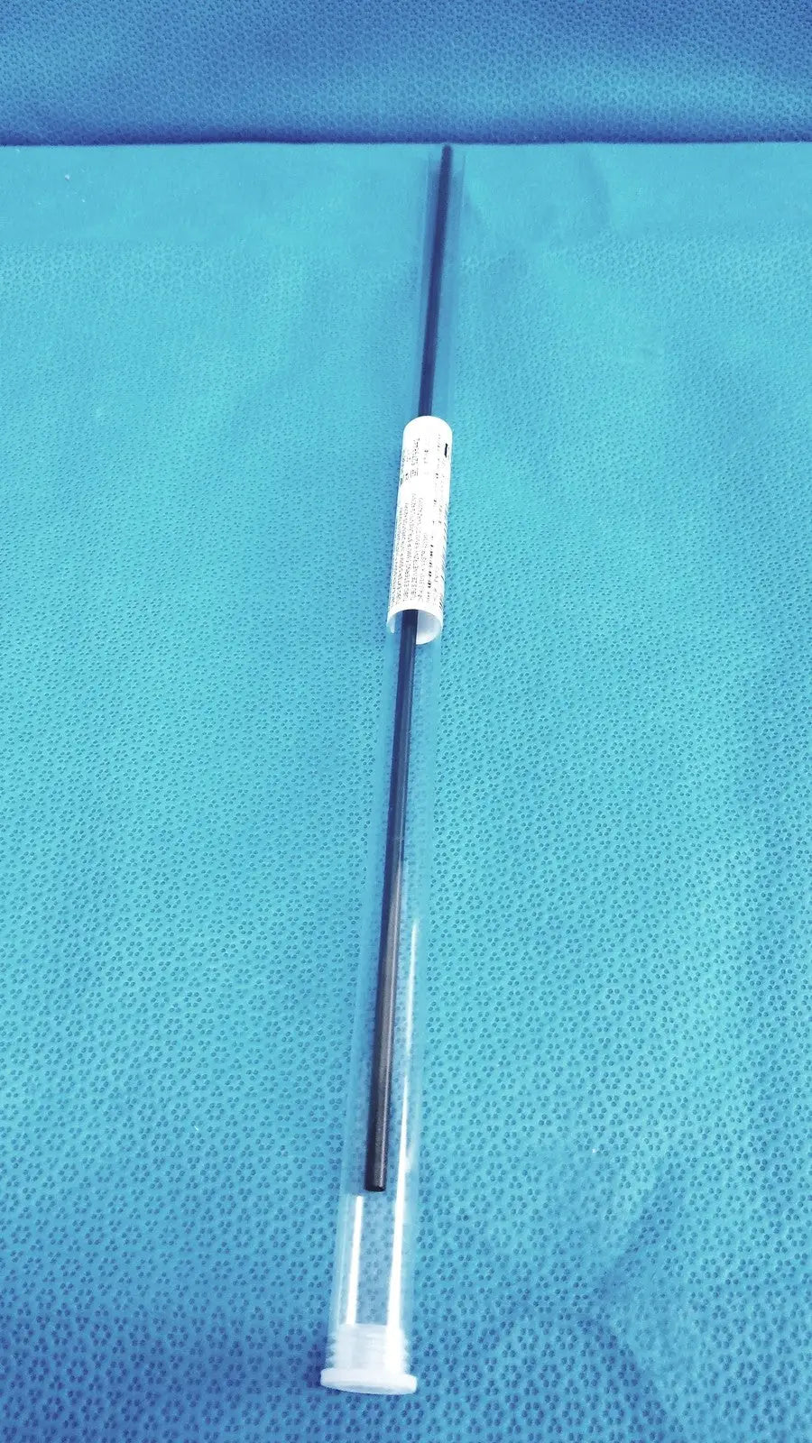 Aesculap laparoscopic grasper ref pm981r black swab with white plastic caps and label in clear protective casing