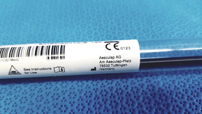 Aesculap laparoscopic grasper ref pm981r metallic instrument with white label showing aesculap ag logo and Germany address