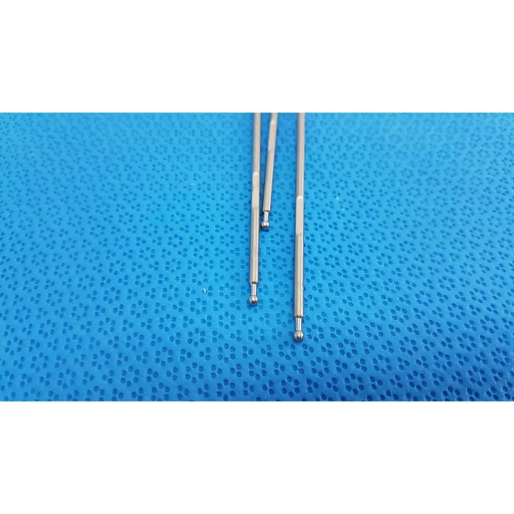 Three polished silver aesculap laparoscopic instrument rods with rounded ball tips on textured blue surface lot of 3