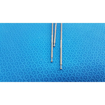 Three polished silver aesculap laparoscopic instrument rods with rounded ball tips on textured blue surface lot of 3