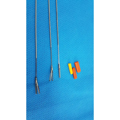 Three metallic aesculap laparoscopic instruments model 33310 with distinct tips and yellow and orange plastic caps for reuse medical use