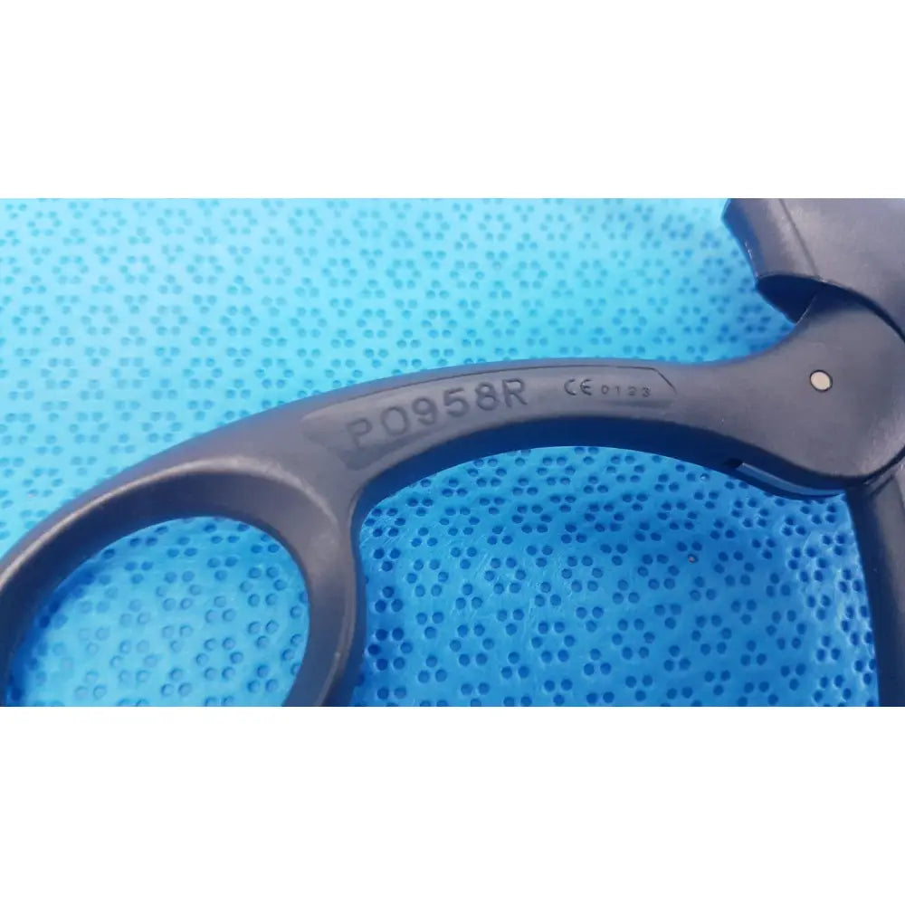 Black plastic aesculap p0958r quick snap laparoscopy handle grip with engraved model number and ce mark back side