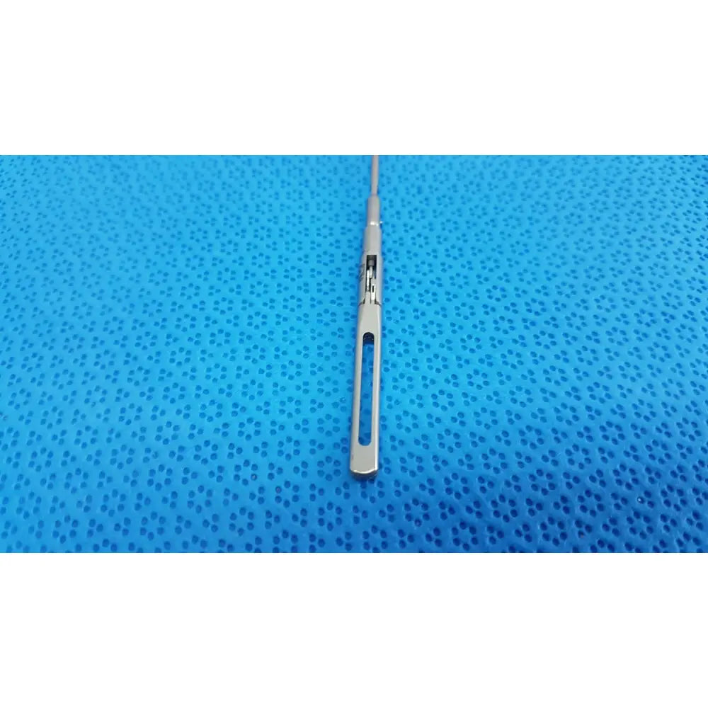 Silver surgical scalpel with sleek metallic handle and sharp blade in aesculap pm618r laparoscopic instrument