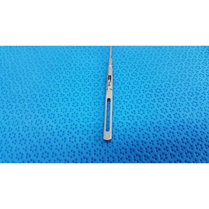 Silver surgical scalpel with sleek metallic handle and sharp blade in aesculap pm618r laparoscopic instrument