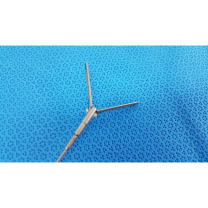 Silver surgical instrument with three prongs and jointed body aesculap pm618r laparoscopic instrument pm618r