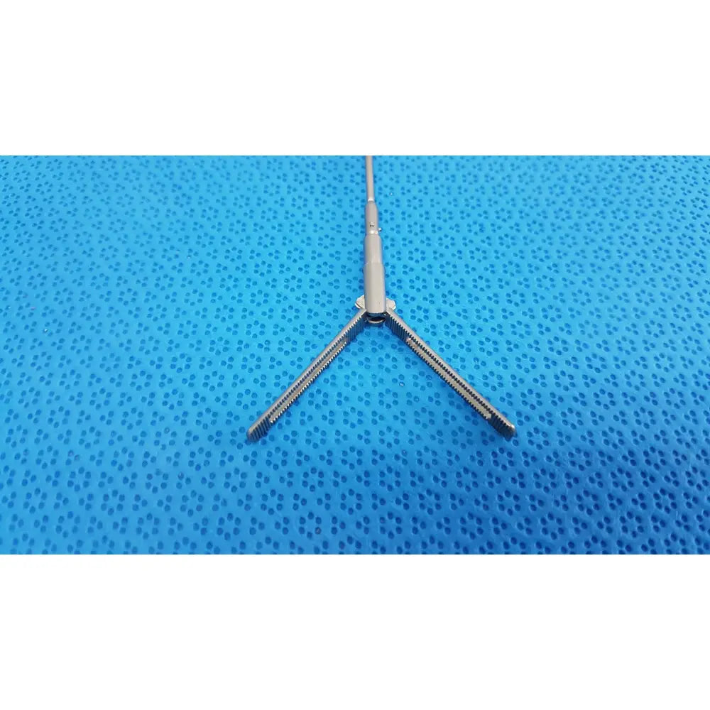 Silver metallic aesculap pm618r laparoscopic instrument with three prongs and central shaft for surgical use