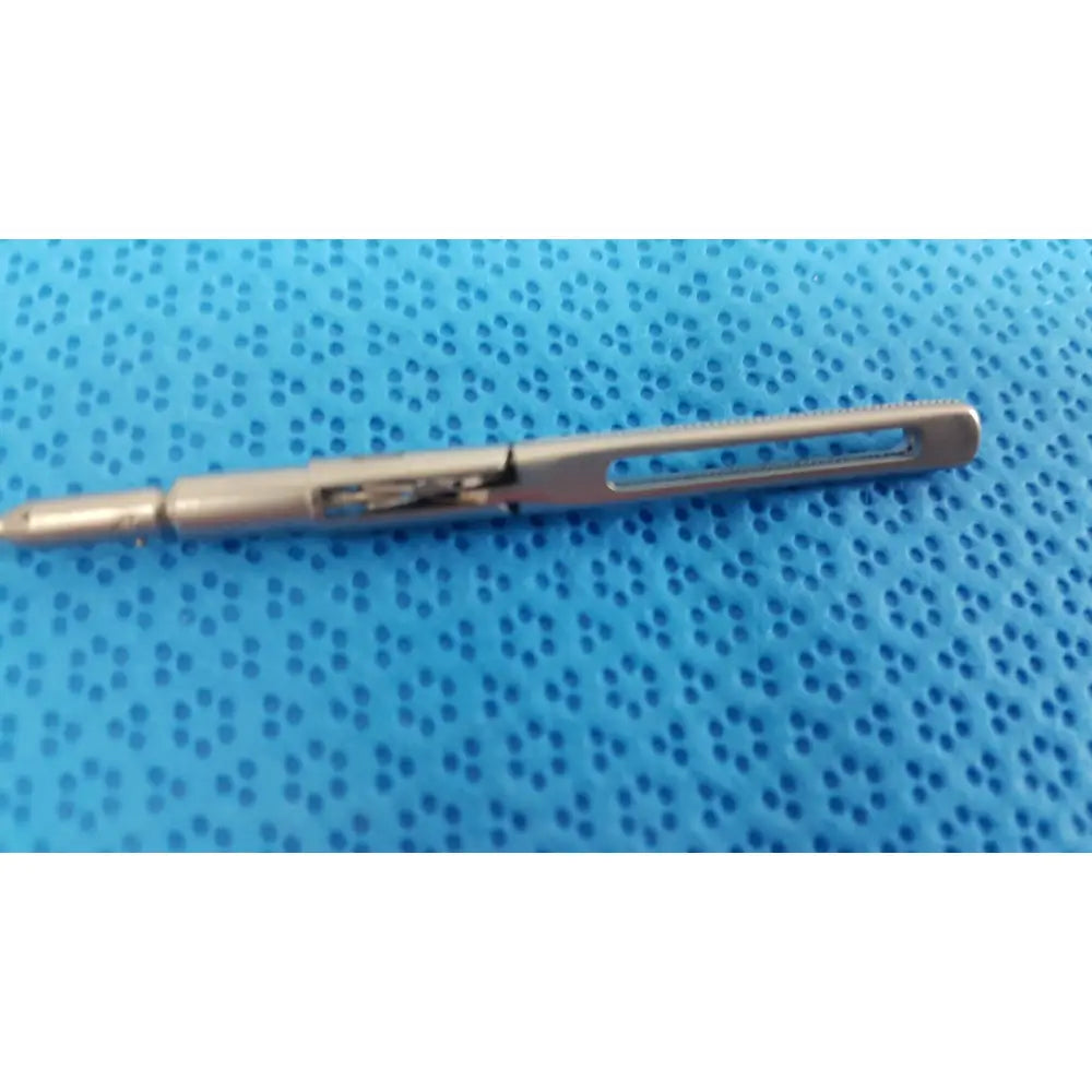 Silver metallic aesculap pm618r laparoscopic instrument pen with textured grip and retractable mechanism