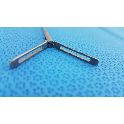 Silver aesculap pm618r laparoscopic instrument with textured ridged jaws and sleek metallic finish surgical forceps