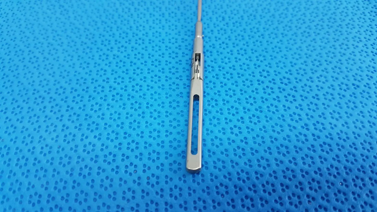 Silver surgical scalpel with sleek metallic handle and sharp blade in aesculap pm618r laparoscopic instrument