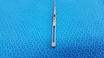 Silver surgical scalpel with sleek metallic handle and sharp blade in aesculap pm618r laparoscopic instrument
