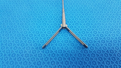 Silver metallic aesculap pm618r laparoscopic instrument with three prongs and central shaft for surgical use