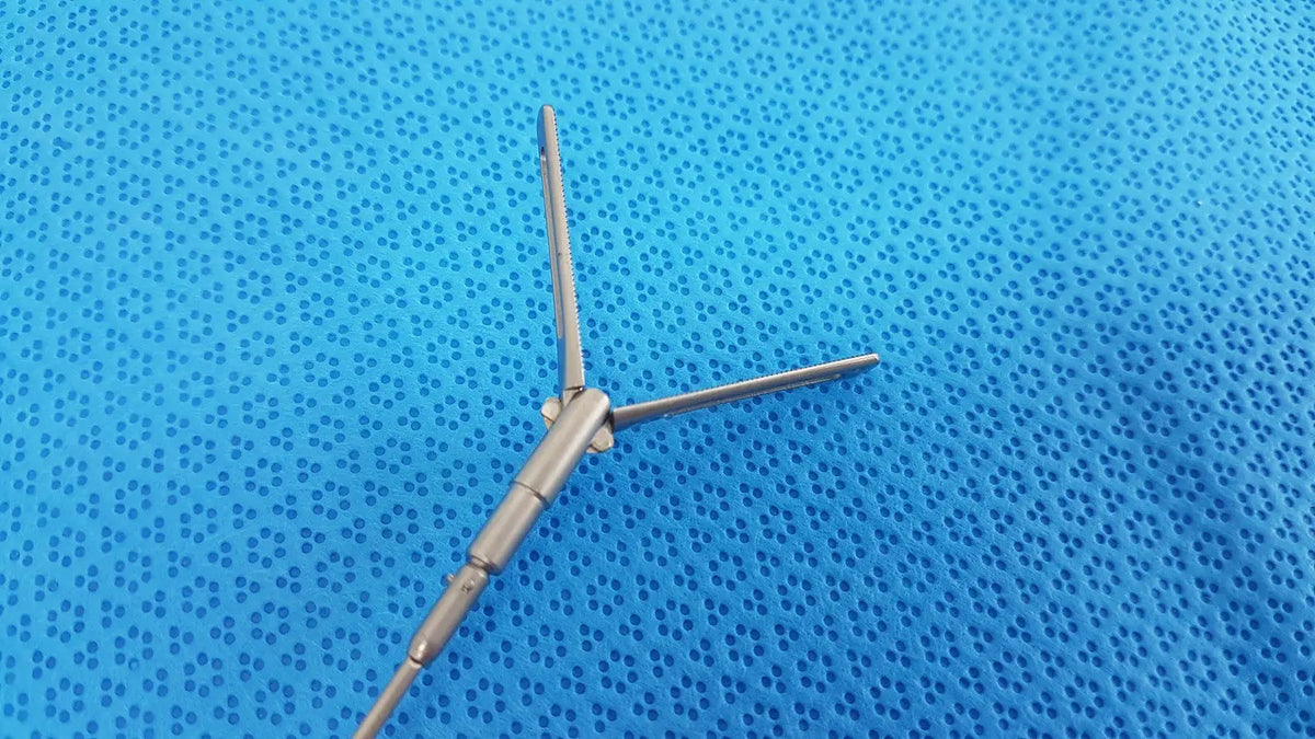 Silver surgical instrument with three prongs and jointed body aesculap pm618r laparoscopic instrument pm618r