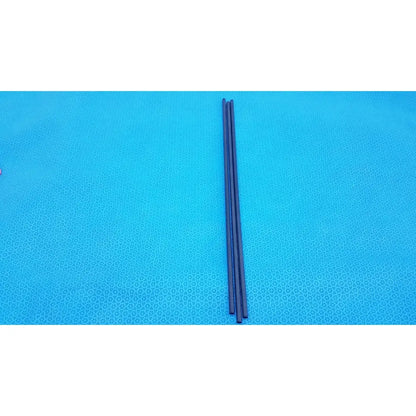 Three slender black aesculap pm973r insulated outer tubes 5 x 310 mm lie parallel on a bright blue textured surface