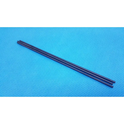 Three black aesculap pm973r insulated outer tubes 5 x 310 mm lie parallel on a blue textured surface in a lot of 3