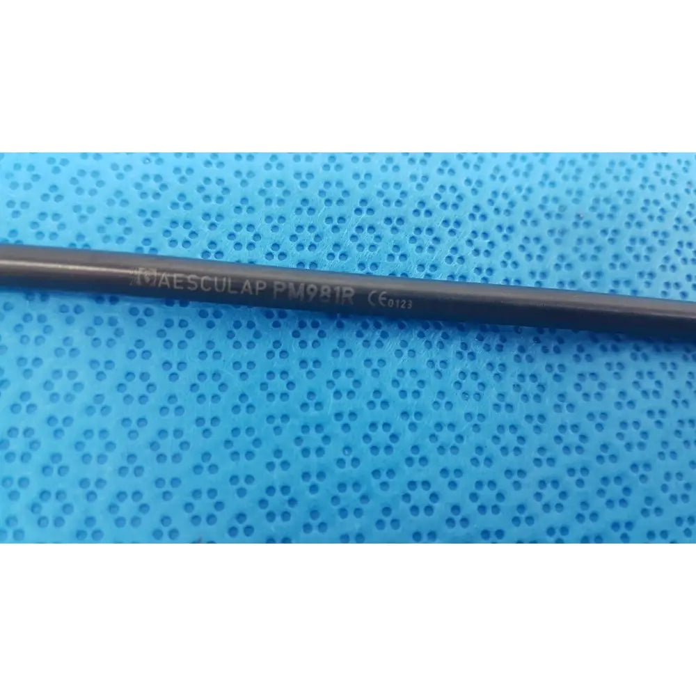 Black metal aesculap pm981r insulated outer tube with engraved text for laparoscopic surgical instrument use