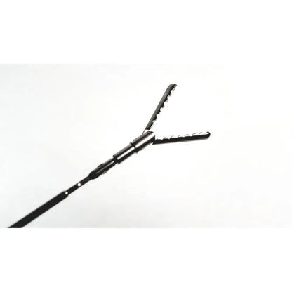 Black aesculap precision dissector surgical instrument with serrated interlocking jaws and slender shaft for surgery