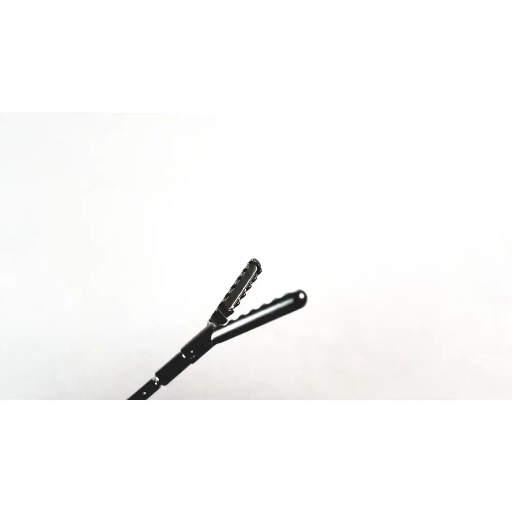 Black aesculap precision dissector surgical instrument with textured grip and serrated jaws for minimally invasive surgery