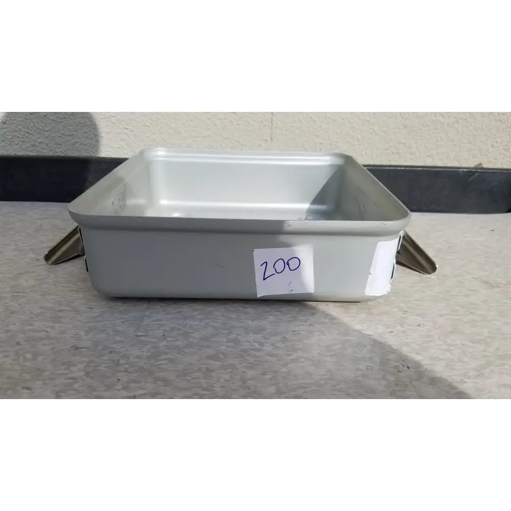 Gray rectangular metal aesculap sterilization container without lid with two small metallic feet and a white label 200
