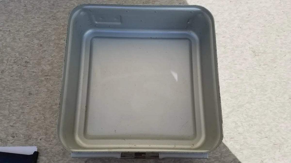 Gray plastic square aesculap sterilization container without lid with rounded corners and slightly raised rim