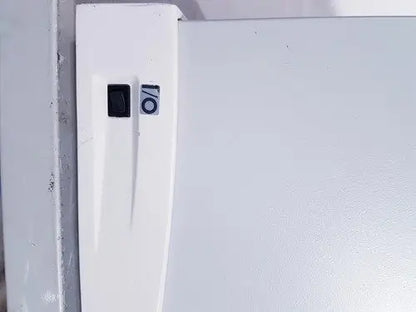 White refrigerator door with black power switch and circular sticker on affymetrix genechip fluidics station 450