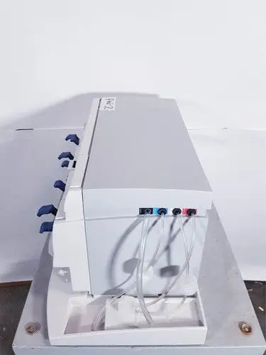 Gray plastic affymetrix genechip fluidics station 450 with blue black and red connectors for genechip fluidics use